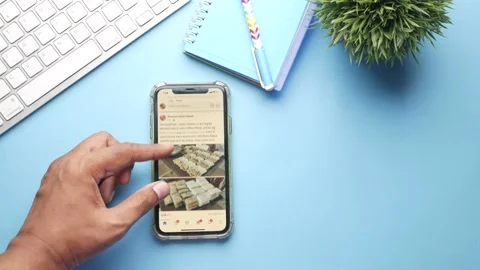 Young man hand scrolling facebaook on smart phone Stock Footage 152793681