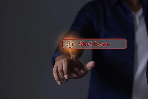 Young man hand touching Shut Down button press power OFF 스톡 사진