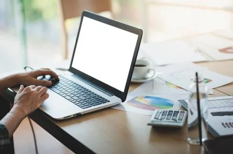Young man hand using laptop computer on office table Stock Photos