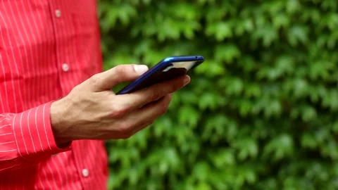 Young man hand using smartphone mobile outside. Business lifestyle. Online web Video stock 133398394