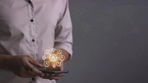 Young man hand using smartphone to Interconnect, Interconnected Concept; Pe.. Stock Photos