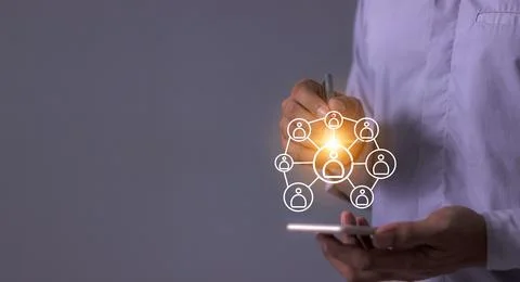 Young man hand using smartphone to Interconnect, Interconnected Concept; Pe.. Stock Photos