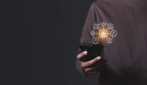 Young man hand using smartphone to Interconnect, Interconnected Concept; Pe.. Stock Photos
