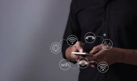 Young man hand using smartphone with to Interconnect, Interconnected Concep.. Stock Photos