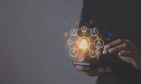 Young man hand using smartphone to Interconnect, Interconnected Concept; Pe.. Stock Photos