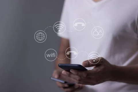 Young man hand using smartphone with to Interconnect, Interconnected Concep.. Stock Photos