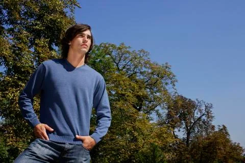 Young man with hands in pockets Stock Photos