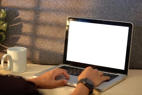 Young man hands typing on keyboard of laptop computer. Foto stock