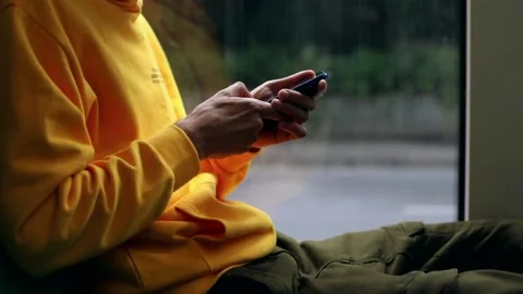 Young man hands using modern smartphone gadget traveling by city bus. Navigation Видео 135521056