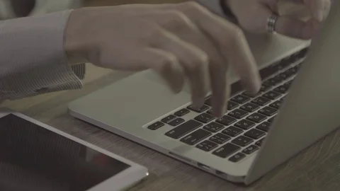 Young man hands using notebook on a table, 4k footage shot in 24fps Stock Footage 89532965