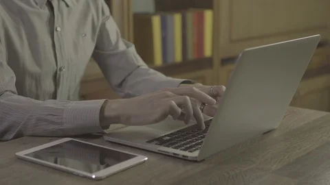 Young man hands using notebook on a table, 4k footage shot in 24fps Stock Footage 89532966
