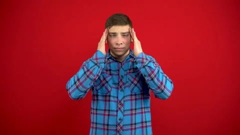 A young man has a headache, she is massaging his temples. Shooting on a red Stock-Footage 147395485
