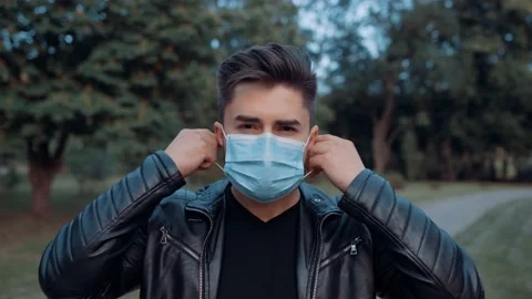 Young man has a mask because of the new covid virus 19 Stock Footage 131665639