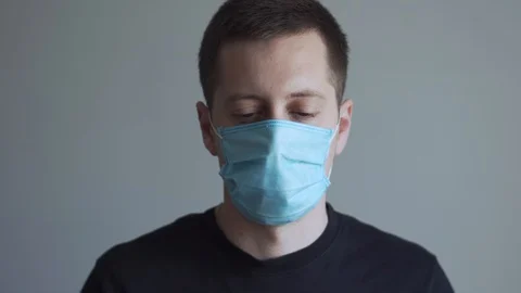 Young man has shocked face after checking the body temperature. Stock Footage 127996311