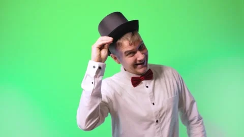 Young man in a hat and a bowtie artist performer dances 스톡 동영상 170572014