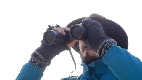 Young man in hat with binocular Stock Footage 86926829