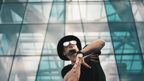 Young man in hat dance Stock Footage 95016860