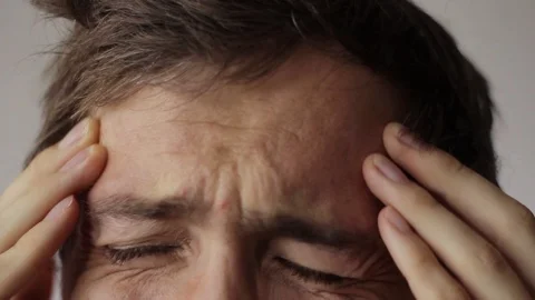 Young man have a headache Stock Footage 98710651