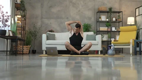 Young man have online training on laptop at home exercise, stretch Stock Footage 278333161