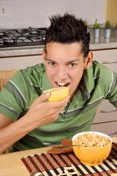 Young man having breakfast Stock Photos