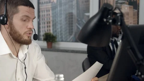 Young man having business call in office Stock-Footage 125458007