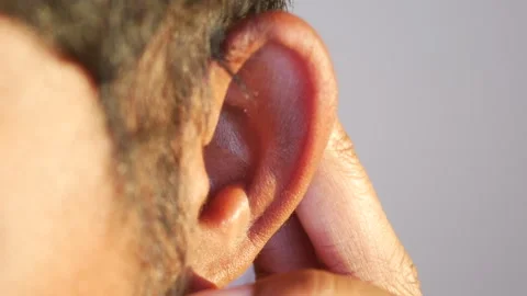 Young man having ear pain touching his painful ear , Stock Footage 289353138