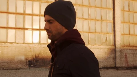 Young man having evening training outdoor. Urban sunset background. Fitness Stock Footage 129651246