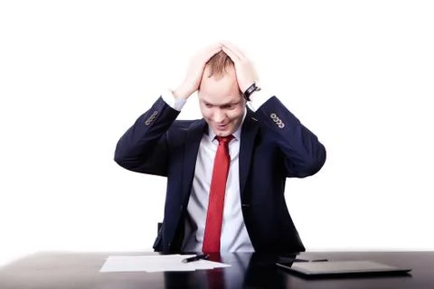 A young man is having an expression of surprise on his face when checking the Stockfoto's