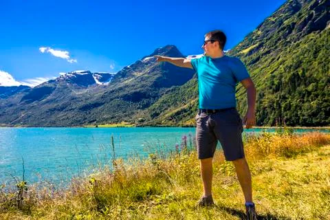 Young man is having fun hiking in Norway Stock Photos