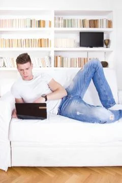 Young man having love problems over laptop 스톡 사진