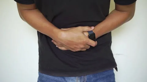 Young man having a stomachache Stock Footage 322109925