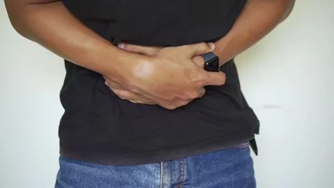 Young man having a stomachache Stock Footage 322109935