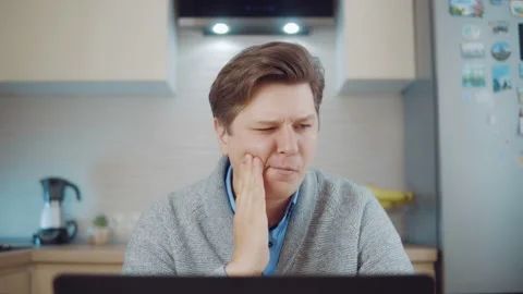 Young man having a toothache Stock Footage 148832129