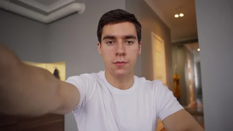 Young man having video call from home Video stock 128763151