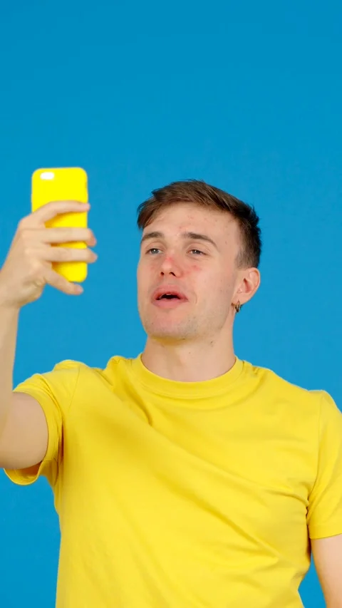 Young man having video call on phone. Stock Footage 254458345