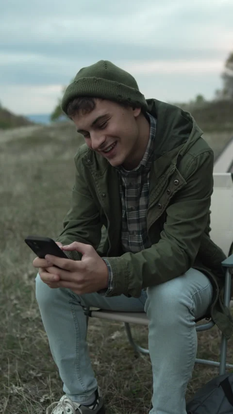 Young man having video call outdoors Stock Footage 319783515