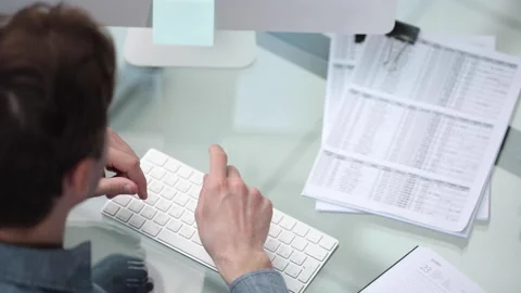 Young man having Zoom video conferencing call via computer Stock Footage 244950138