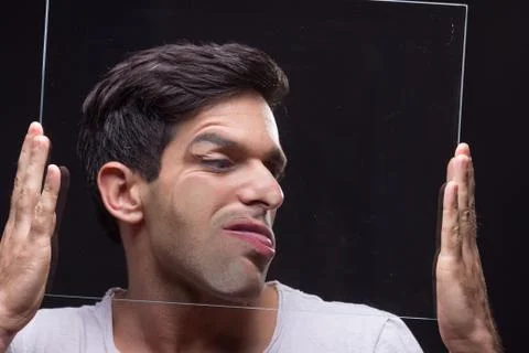 Young man head face pressed against glass Stock Photos