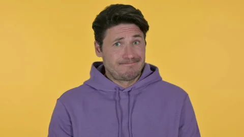 Young Man Head Shake No Sign, Yellow Background Video stock 141672834