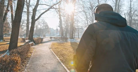 Young man with headphone walking Stock Footage 146554283
