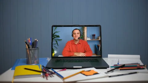 Young man in headset with microphone holding online meeting conversation Stock Footage 153276295