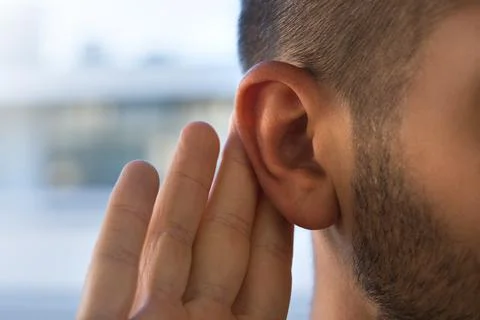 Young man with hearing problems, hearing loss or hard of hearing Stock Photos