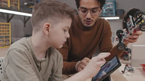 Young Man Helping His Student During Class Stock Footage 203818586