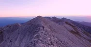 Young Man Hiking On Top Of Mountain During Sunset Adventure Nature Extreme Sport Stock Footage