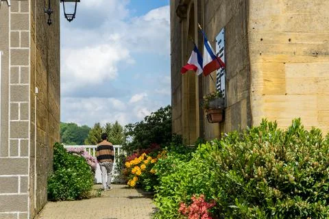 Young man with his back between old buildings of typical French architecture Stock Photos