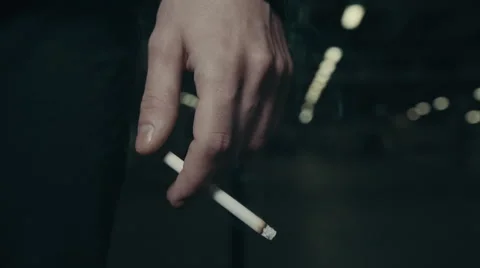Young man hold cigarette in hand Stock Footage 56269672