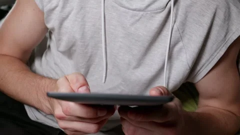 Young Man Holding E-Reader Device and Reading Electronic Book Indoors Stock Footage 339216958