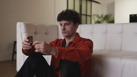 Young man holding engagement ring in box, thinking about marriage proposal Stock Footage 337908455