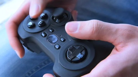 Young man holding game controller playing video games Stock Footage 59899378