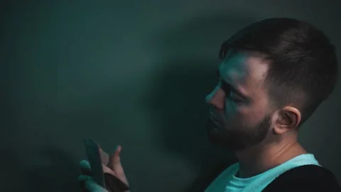 Young man holding an impressive amount of dollar bills in his hands Vidéo 147463958